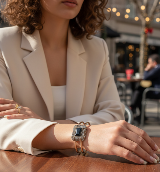 Woman wearing a watch with a blurred outdoor cafe background
