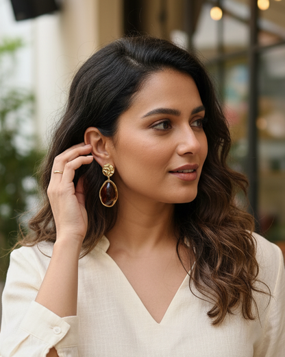 Artistic Profile Gold Drop Earrings with Amber-Tone Acrylic