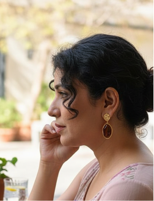 Artistic Profile Gold Drop Earrings with Amber-Tone Acrylic