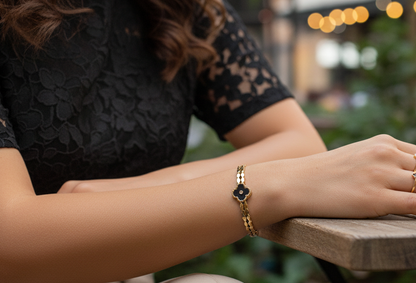 Person sitting at a wooden table with blurred outdoor background