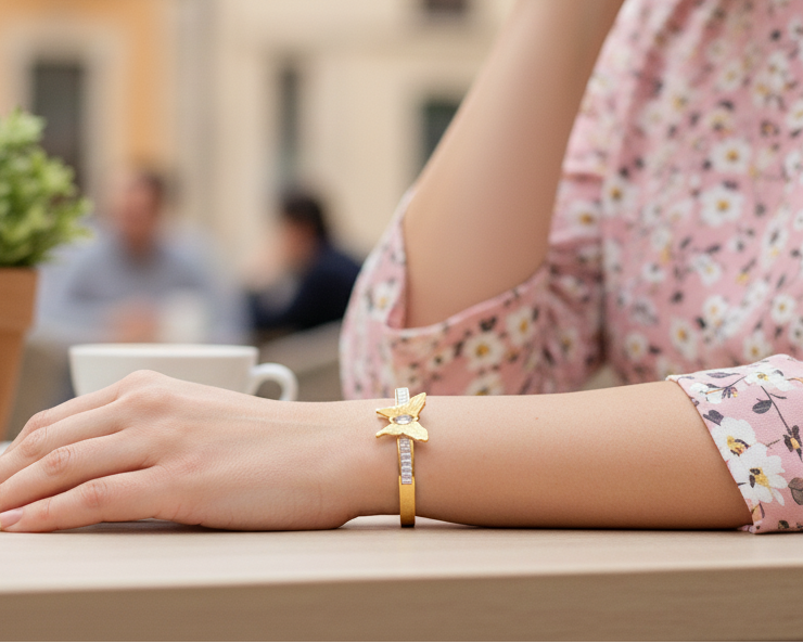 Person wearing a floral dress with a blurred outdoor cafe background