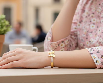 Person wearing a floral dress with a blurred outdoor cafe background