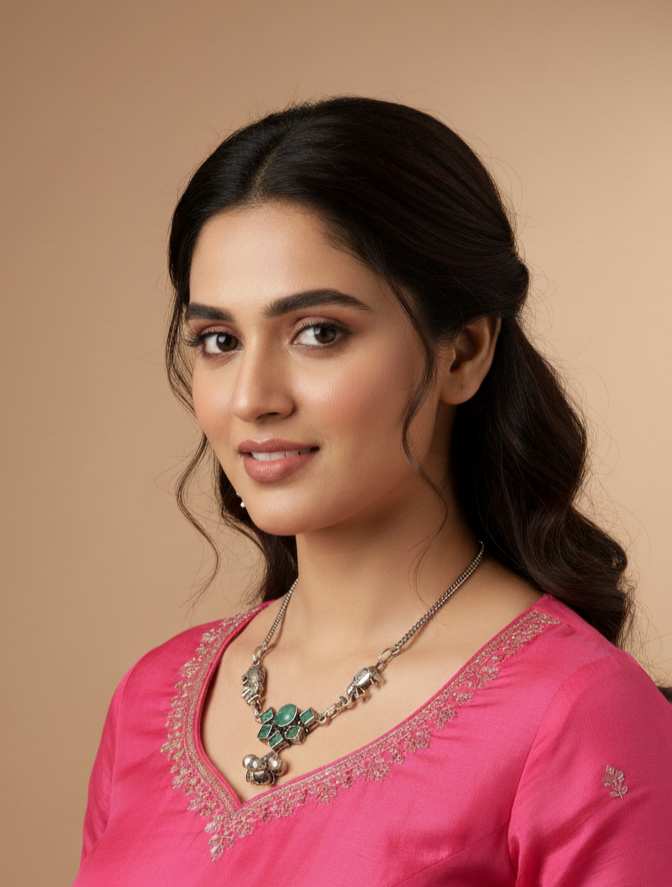 Woman wearing a pink traditional outfit with jewelry against a beige background