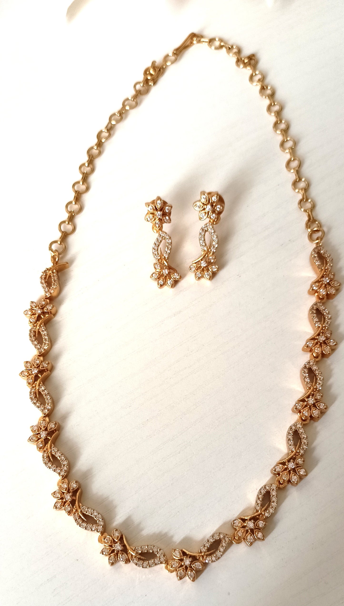 Enchanting Floral Twist Gold-Plated Necklace Set with Coordinated Drop Earrings