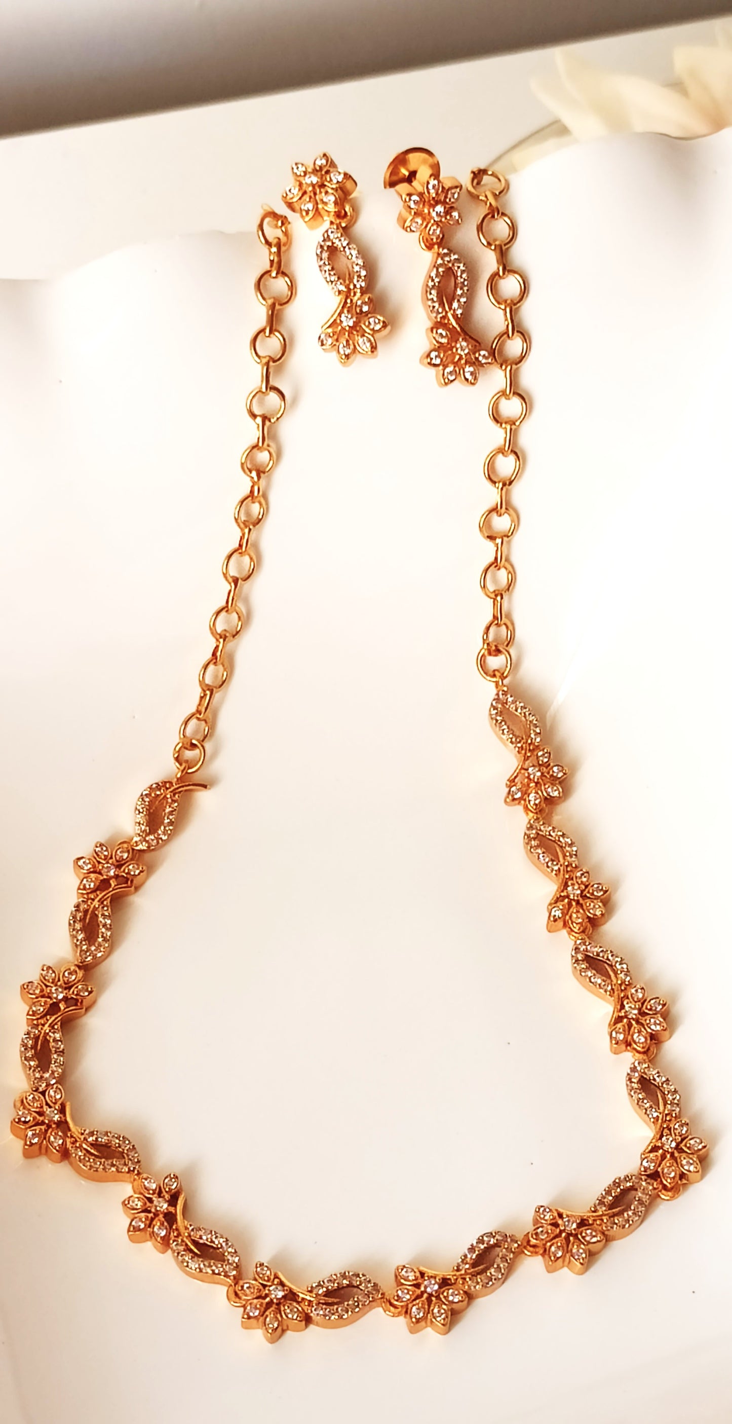 Enchanting Floral Twist Gold-Plated Necklace Set with Coordinated Drop Earrings
