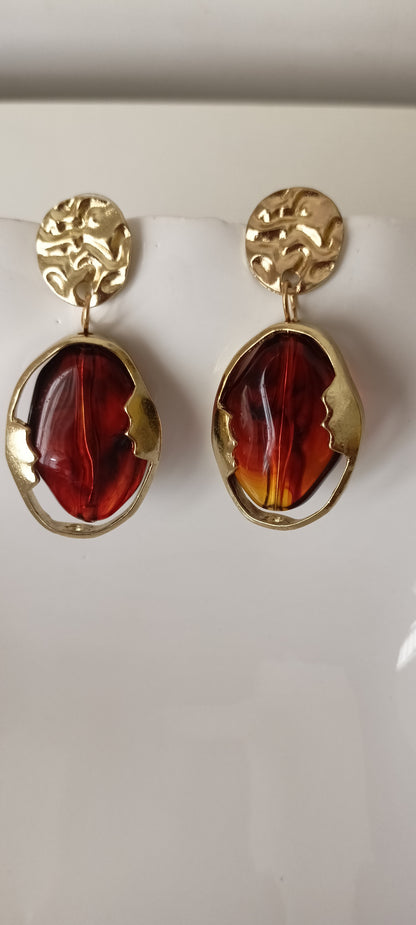 Artistic Profile Gold Drop Earrings with Amber-Tone Acrylic