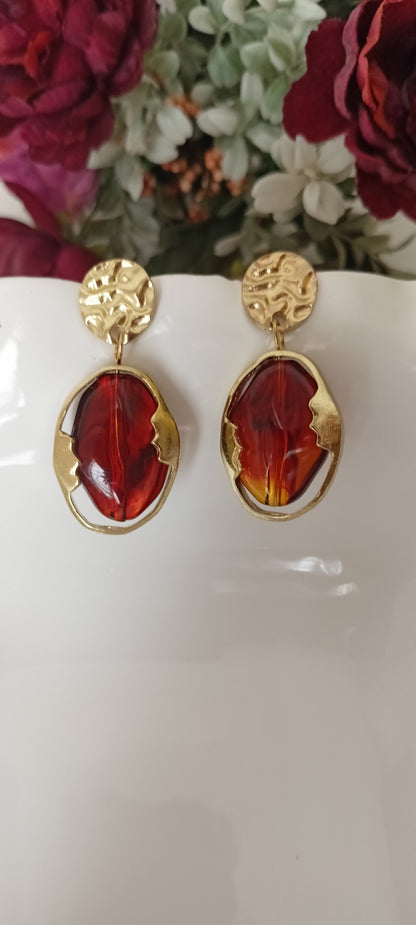 Artistic Profile Gold Drop Earrings with Amber-Tone Acrylic