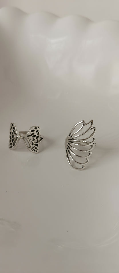 Pair of silver earrings on a white background